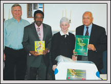 WARREN County Farm Bureau bought Photosynthesis Promenade books for four county schools. Pictured are, from left: Jeff Bender, Warren County Farm Bureau president; Calvin Jones, Warren County Board of Education chairman; Pat Riethmeier, Ag in the Classroom ambassador; and Dr. Ray Spain, superintendent of Warren County Schools. 