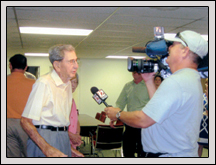 Davidson County Farm Bureau Member Henry Sink is interviewed by a television station after a surprise presentation of eight World War II medals.