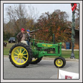 Washington County Farm Bureau Member Mike Harris and his grandson participated in the parade at Farm City Day.