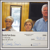 Farm Bureau gave each of the county’s 11 schools $200 for school supplies. Pictured, left to right, are Women’s Committee members Eloise Harrington, Nadine Phifer and Rita Mills and County President Ronnie Mills